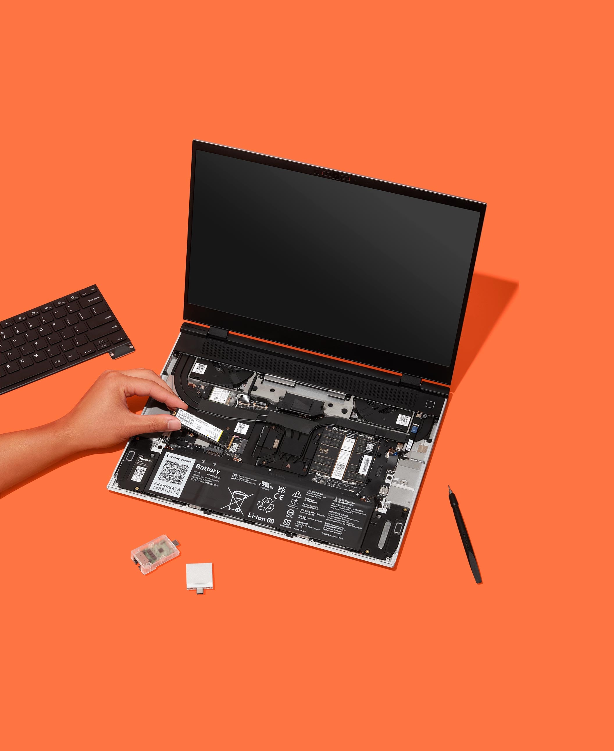 Image of Framework Laptop 16 on orange background