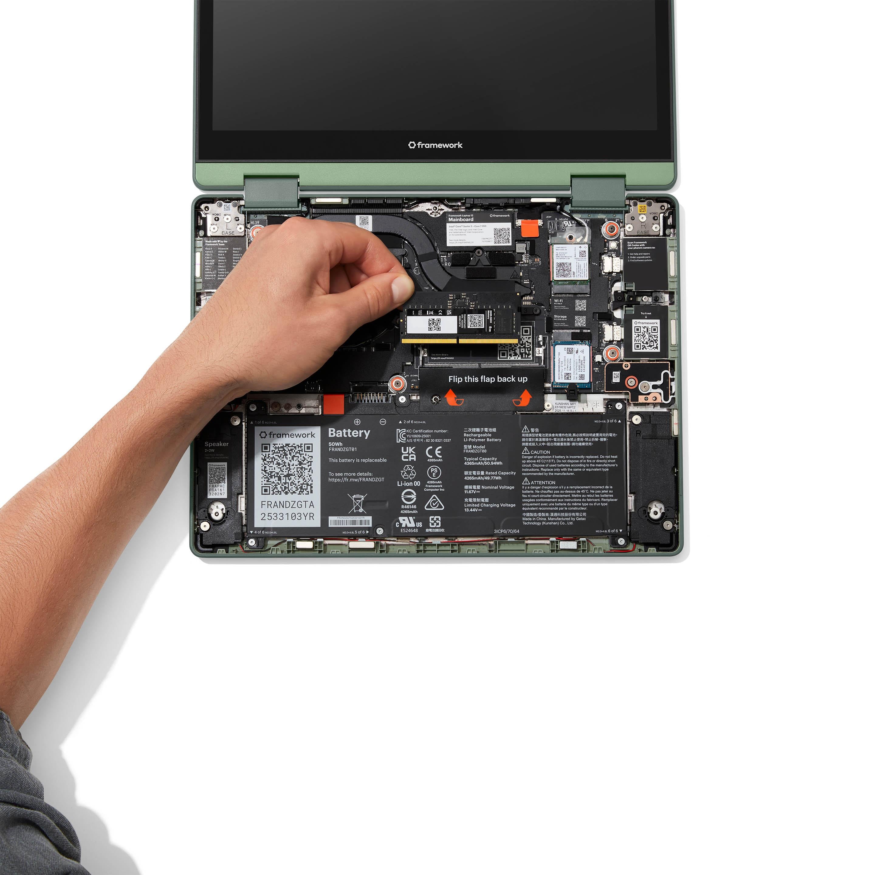 Image of hand installing memory into a Framework Laptop 12