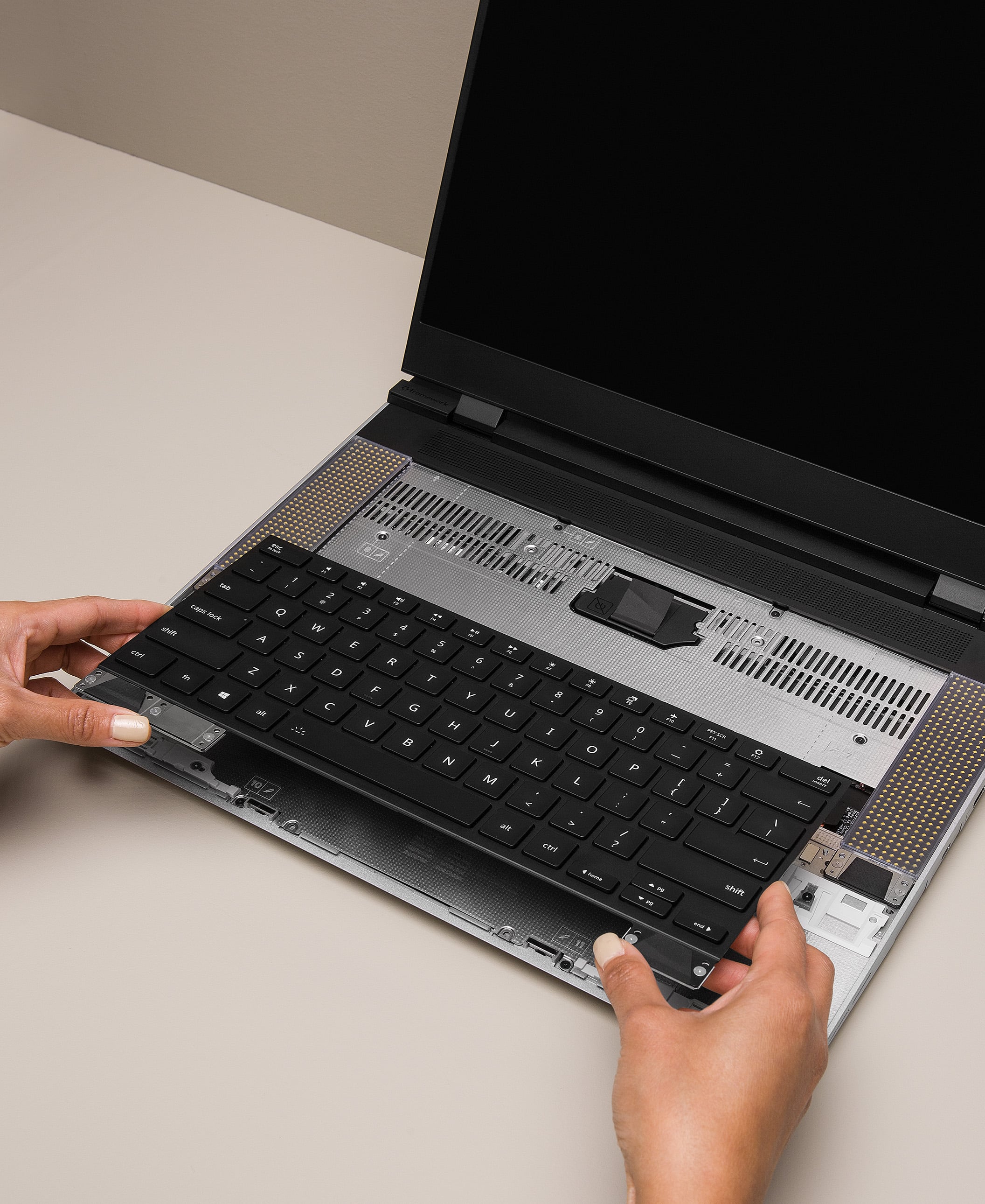 Hands with Framework Laptop 16 Keyboard