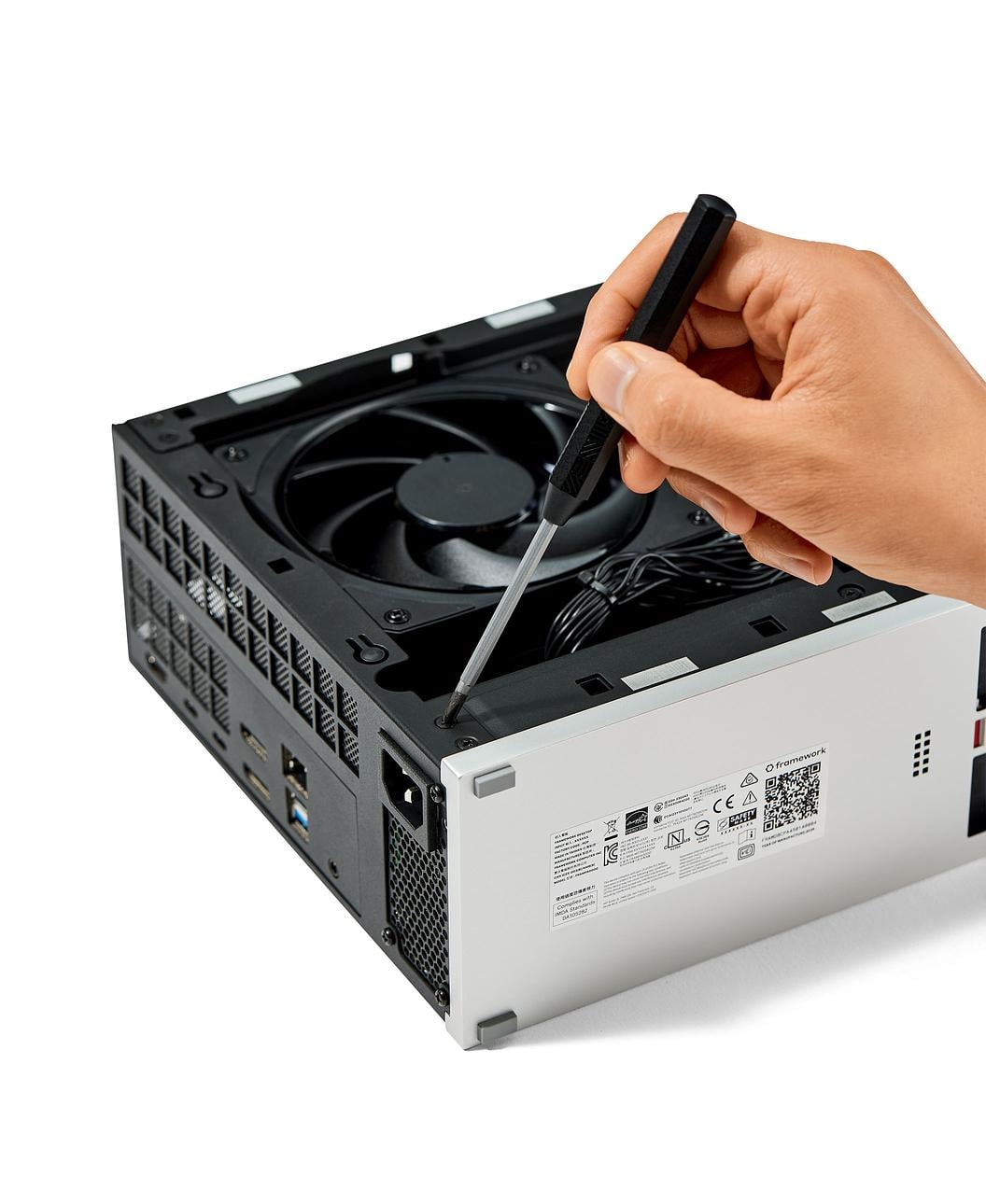 Framework Desktop Screwdriver with hand