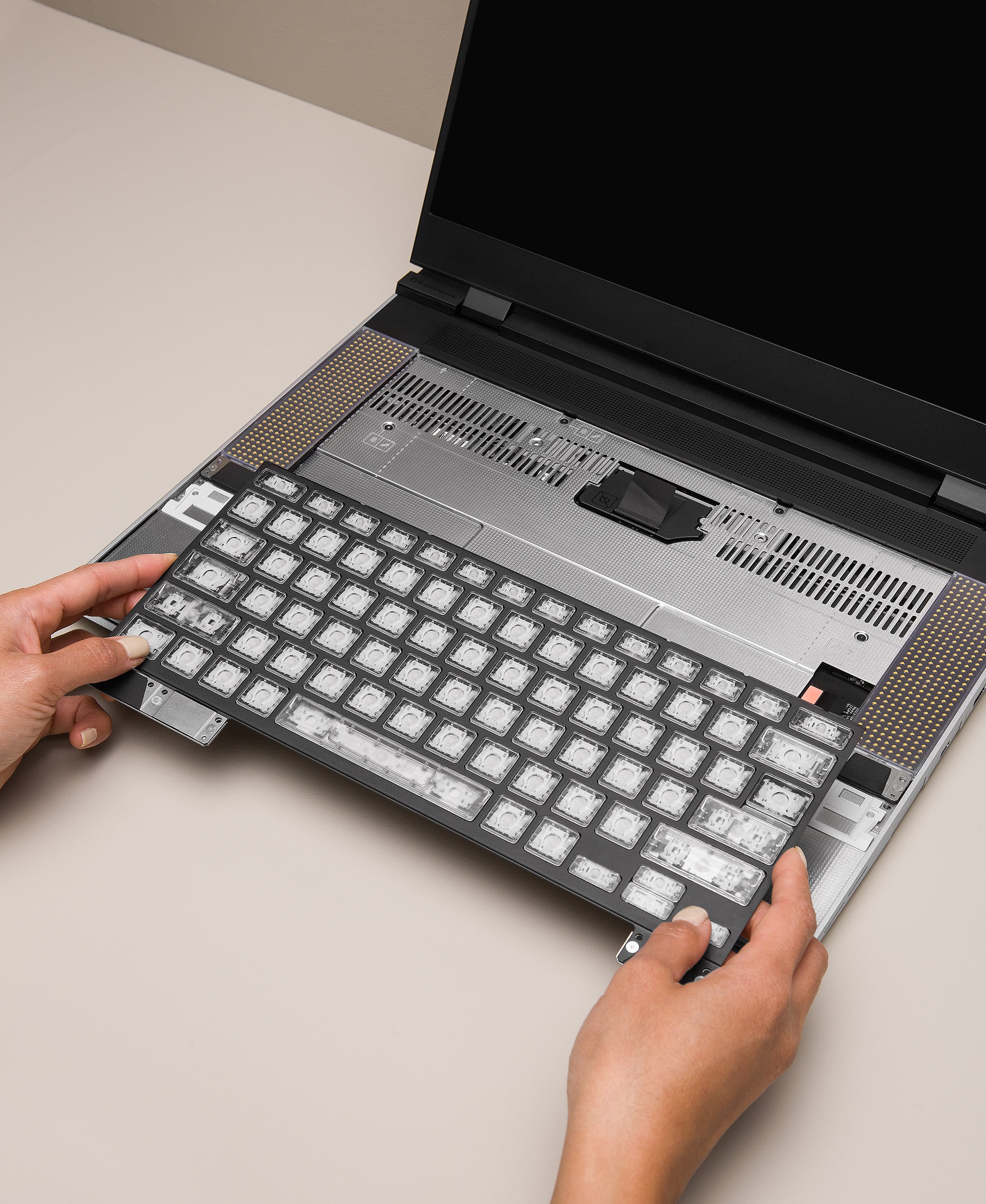 Hands with Framework Laptop 16 Keyboard