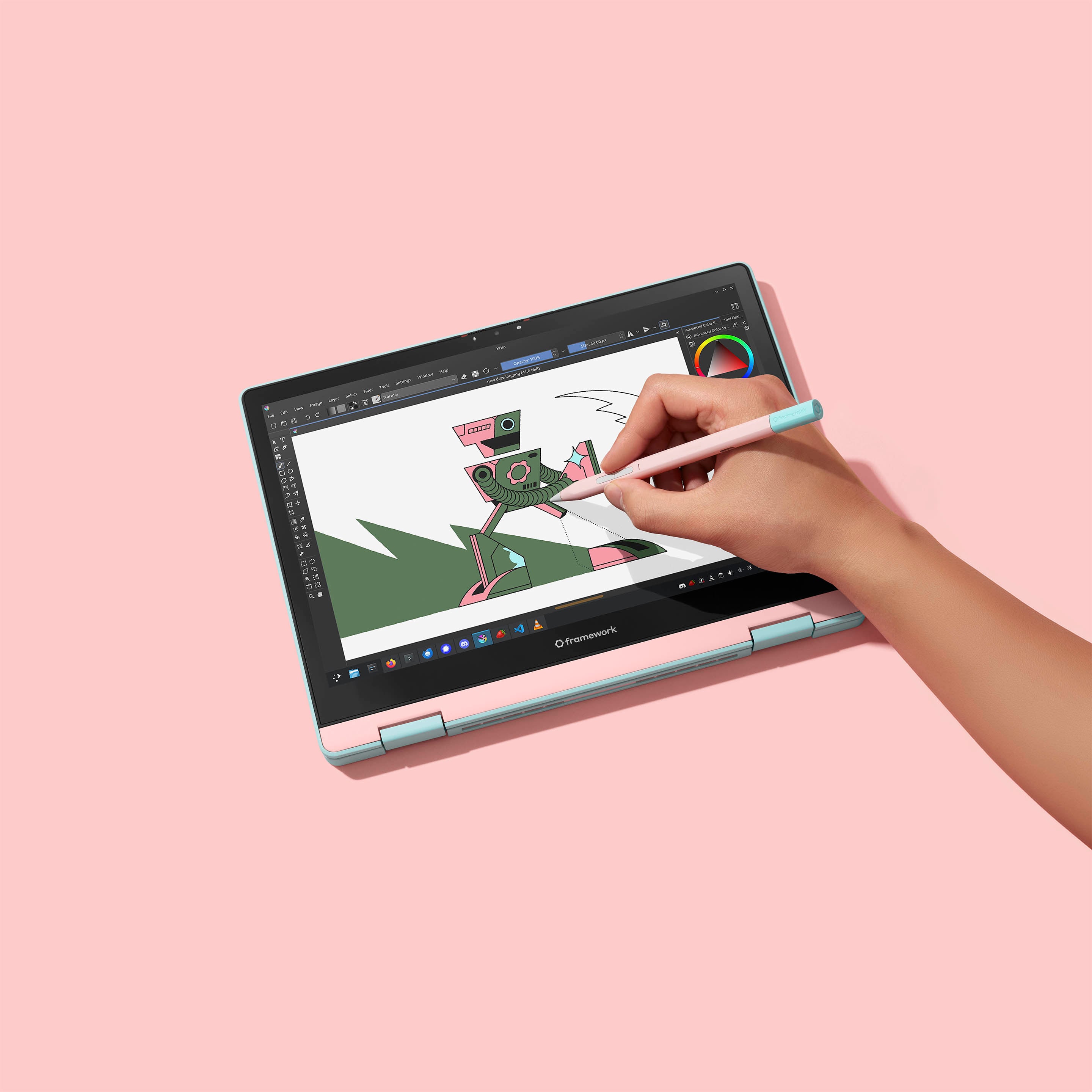 Studio shot of Framework Laptop 12 Stylus in Bubblegum In Use