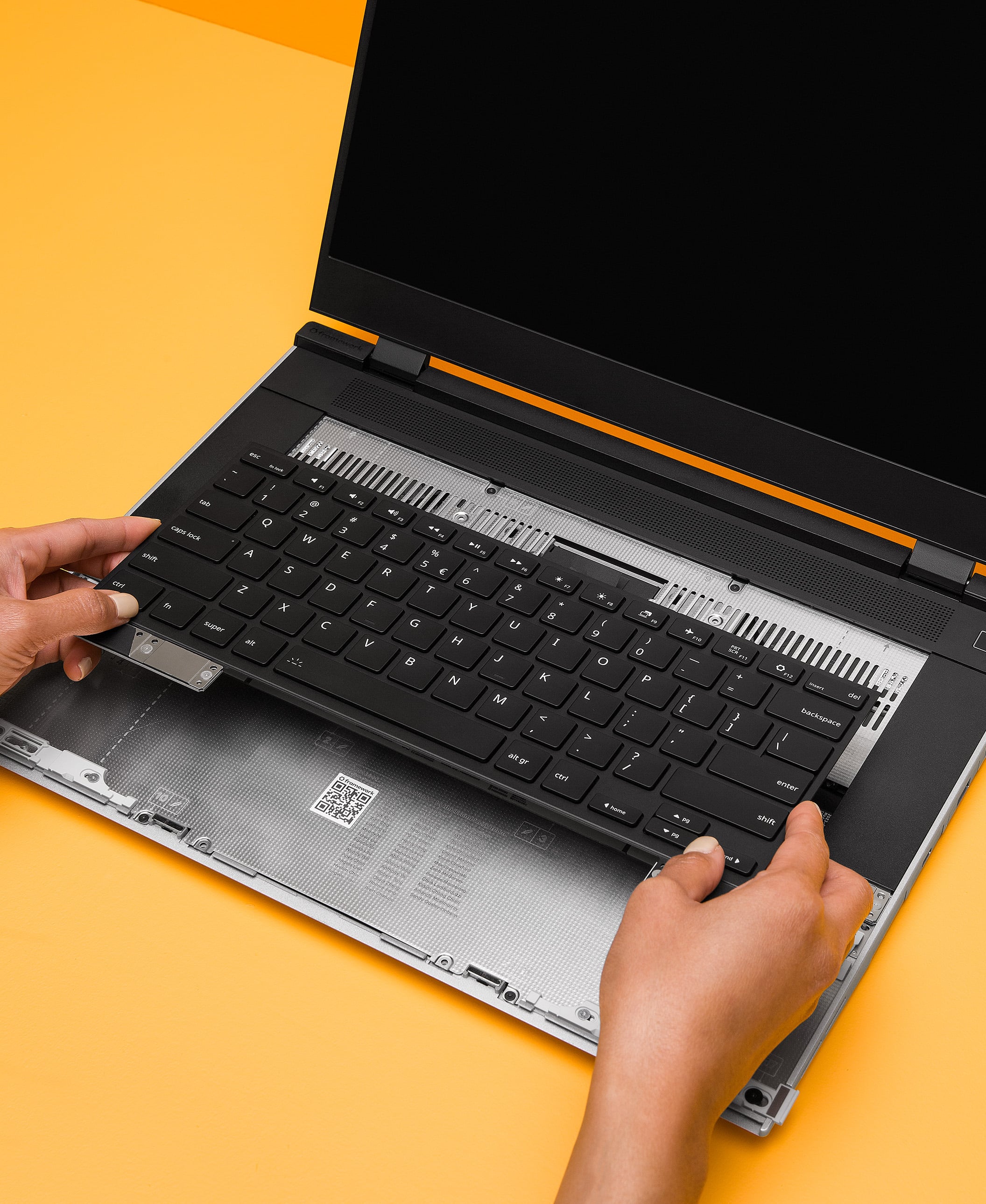 Hands with Framework Laptop 16 Keyboard