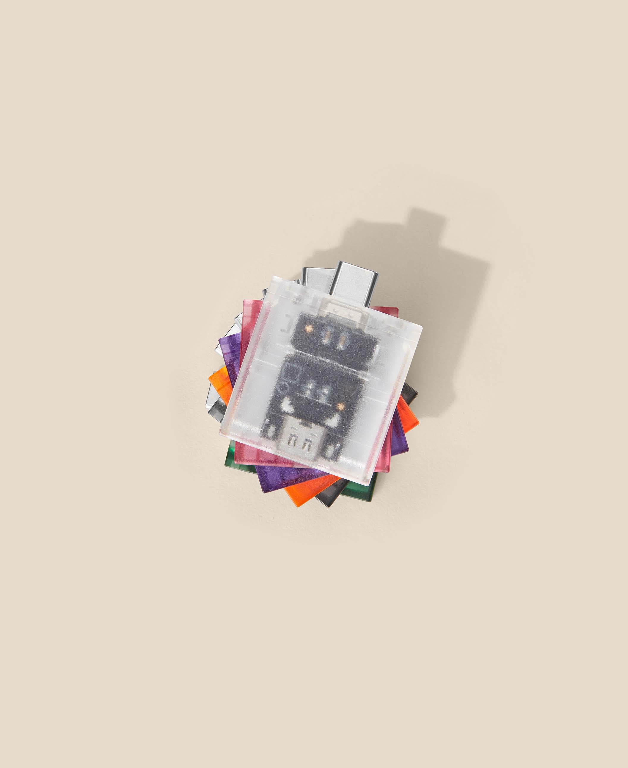 Stack of translucent USB-C expansion cards